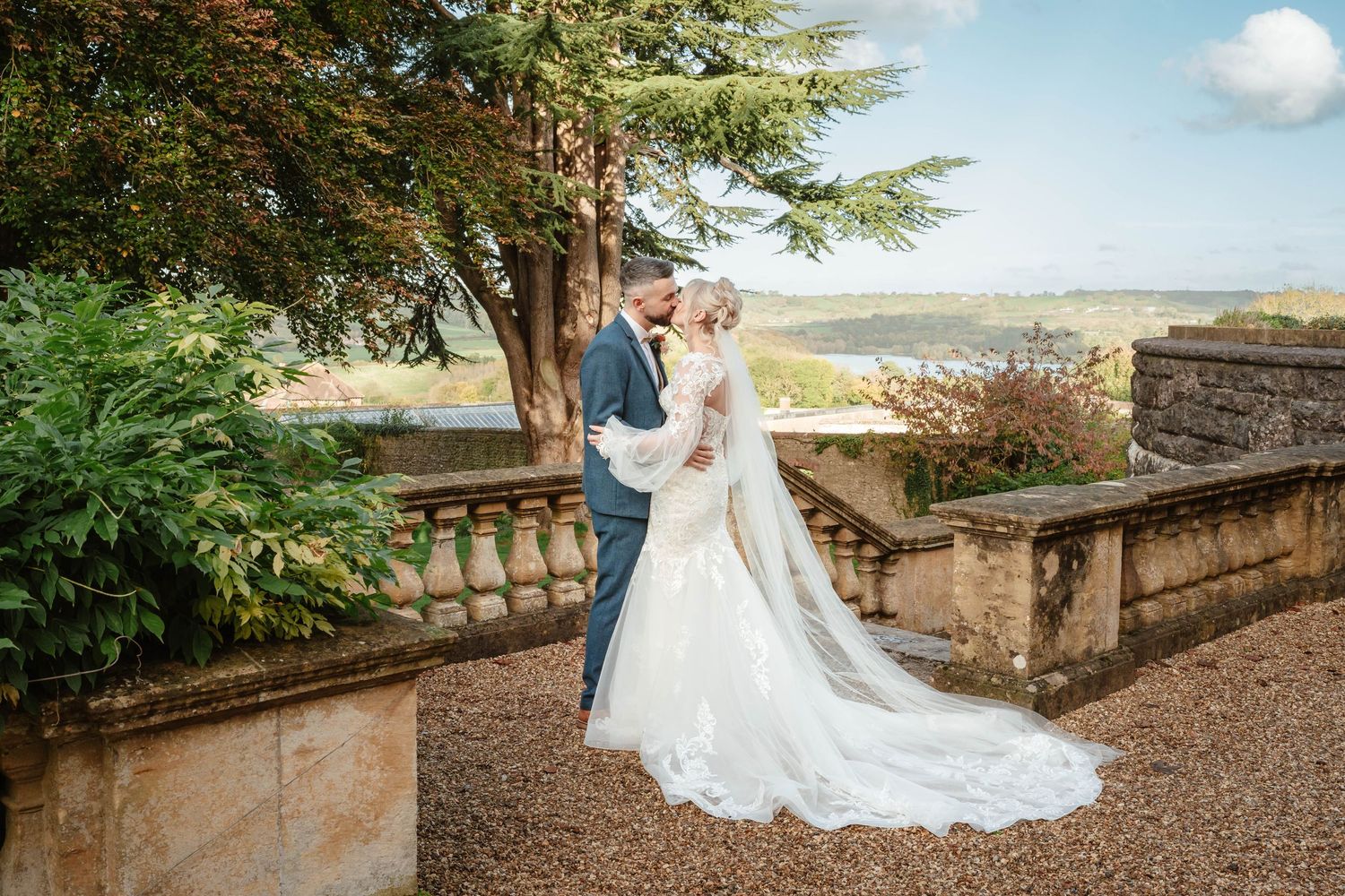 Coombe Lodge Somerset Wedding Photographer Zara Davis Photography bride and groom in front of lake October Wedding Autumn