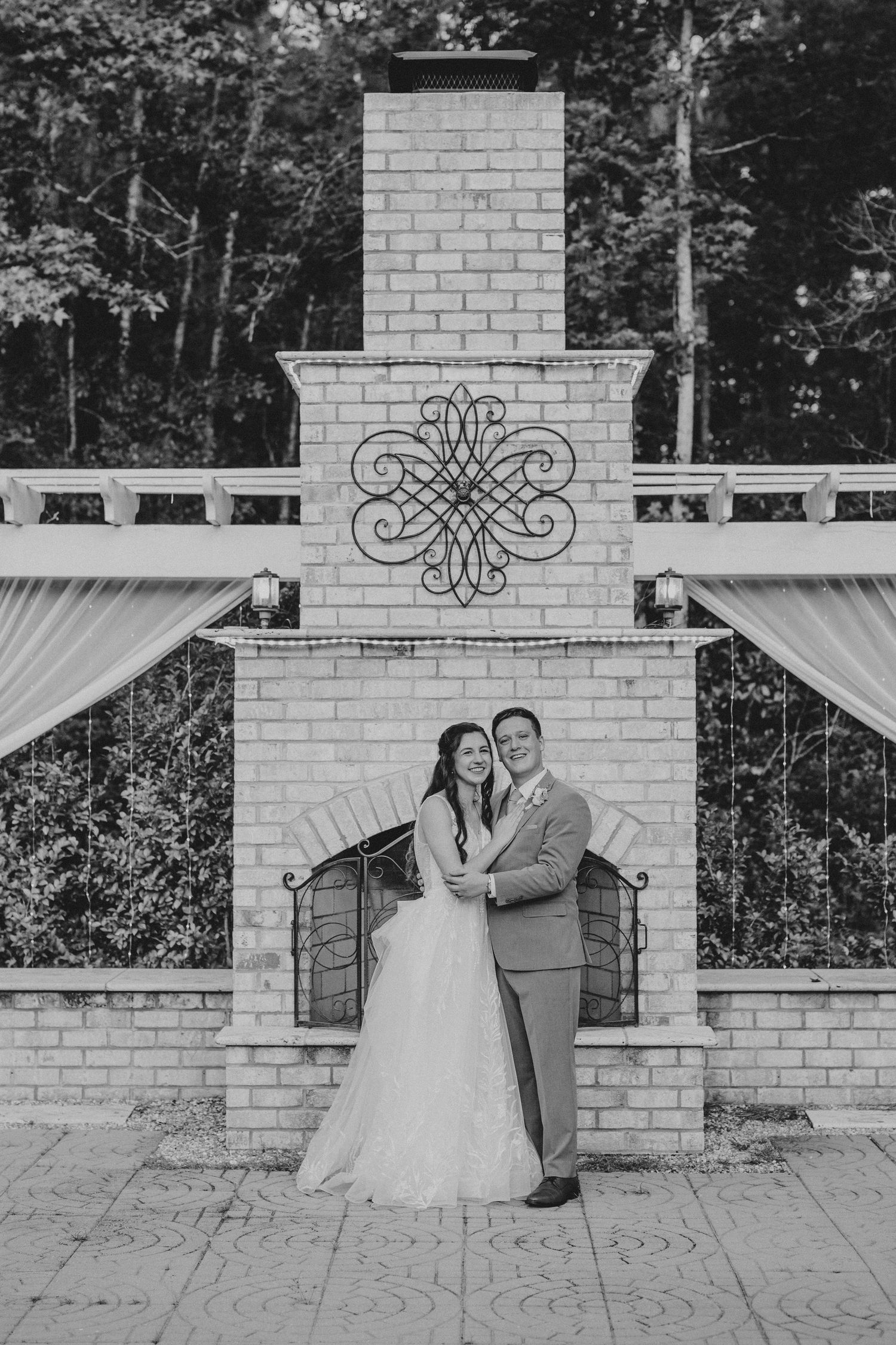 Three connected black and white images showing a wedding venue with white brick columns and decorative metalwork.