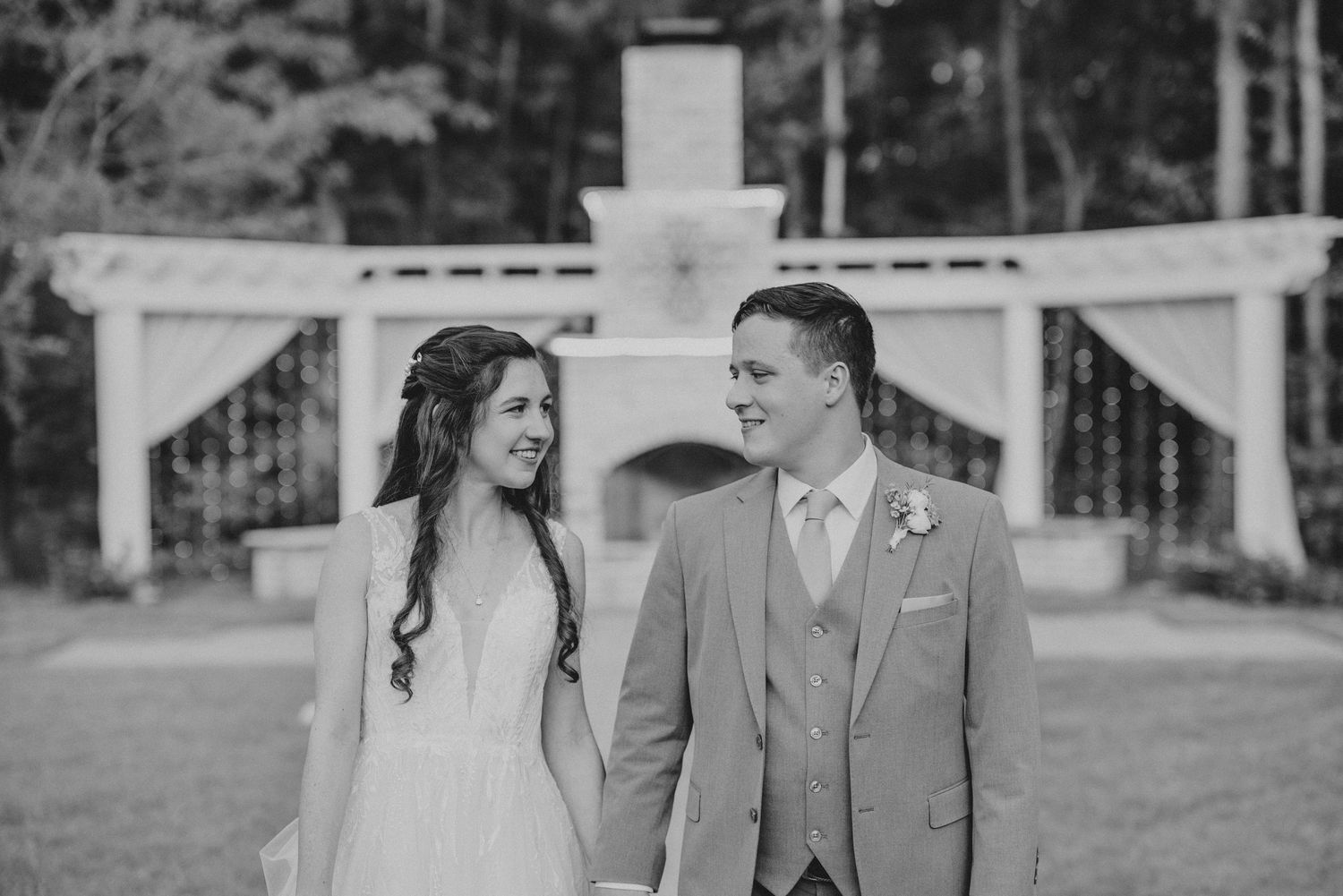 Black and white candid photo sequence showing a couple sharing joyful moments outdoors.