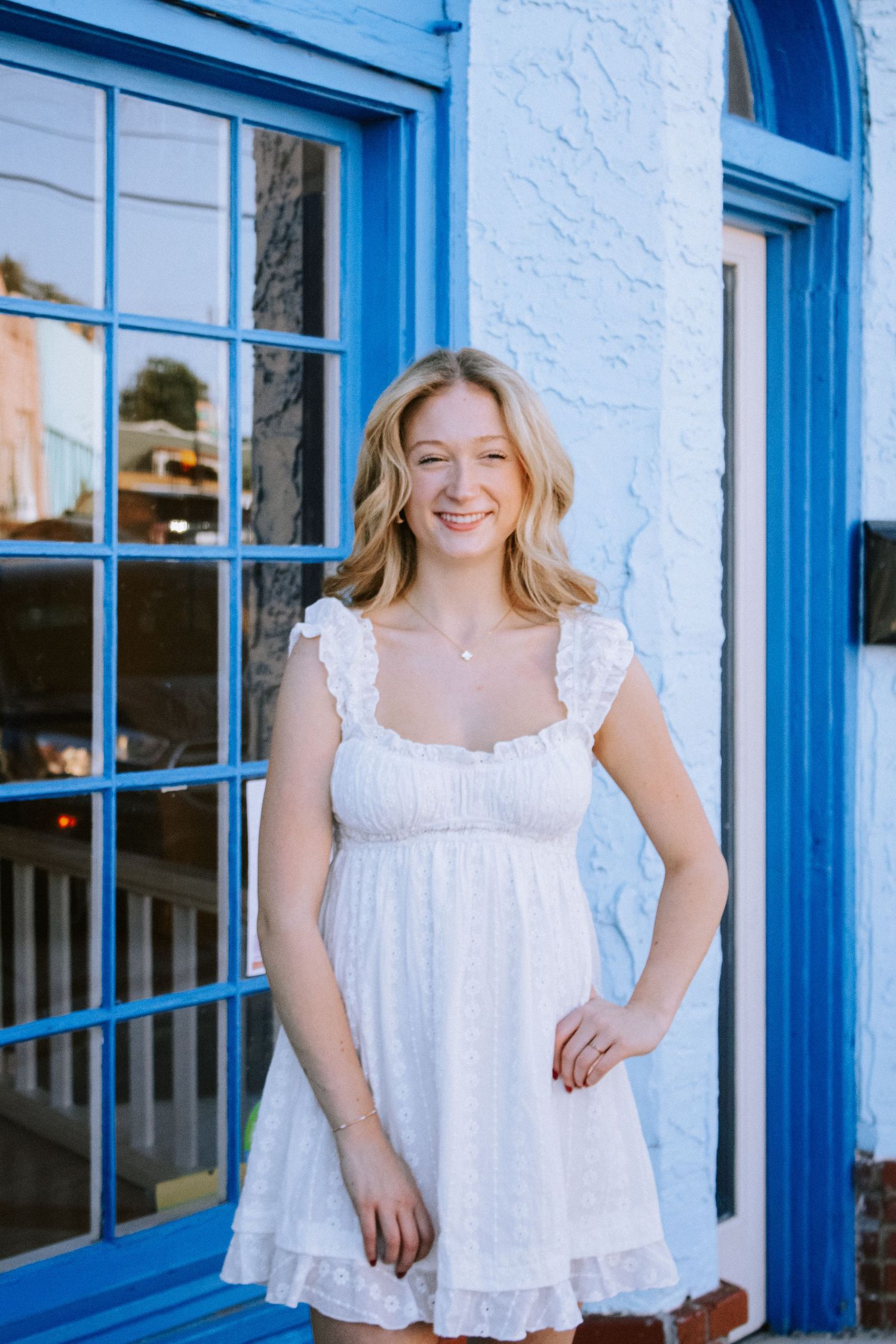 Senior Smiling In Front of Little D Gallery in Oklahoma City