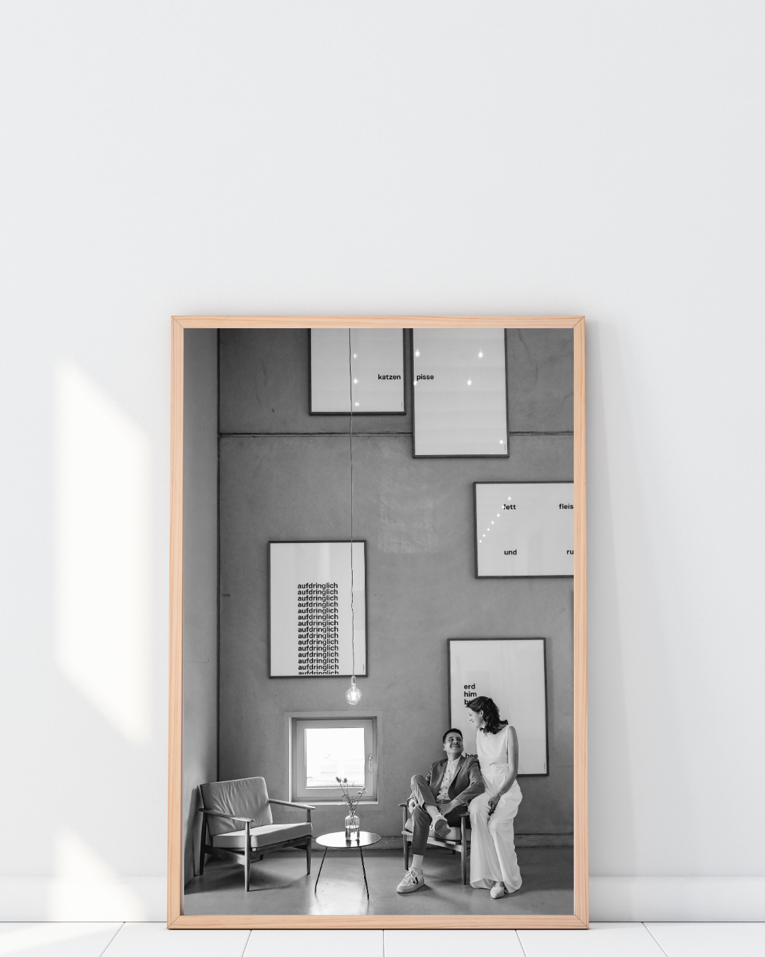 A series of minimalist black and white photographs showing interior architectural spaces with geometric shapes and figures.