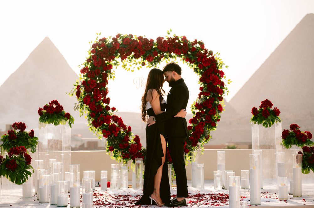 A series of romantic wedding ceremony silhouettes with couples sharing moments under floral arches and archways.