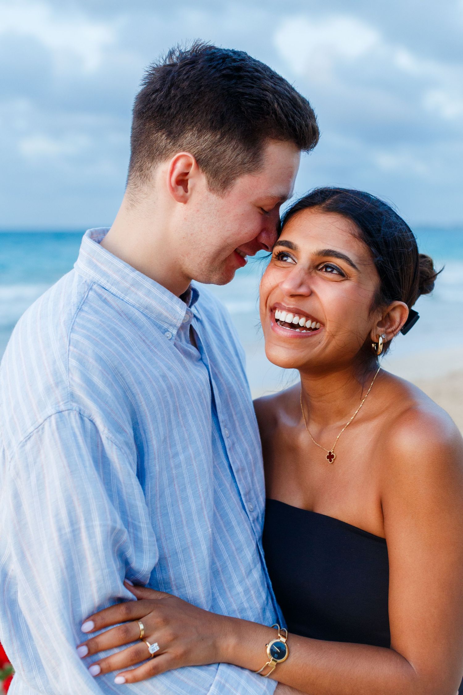 Couples portrait. Marriage proposal on the beach in Isla Verde, Carolina, Puerto Rico.