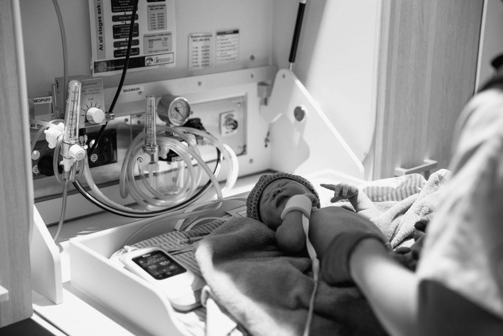 Medical equipment and monitors in a hospital nursery setting.
