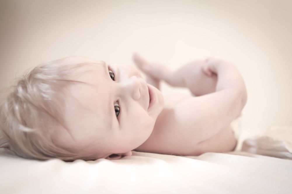 Soft, ethereal portrait series in muted beige tones against light background.