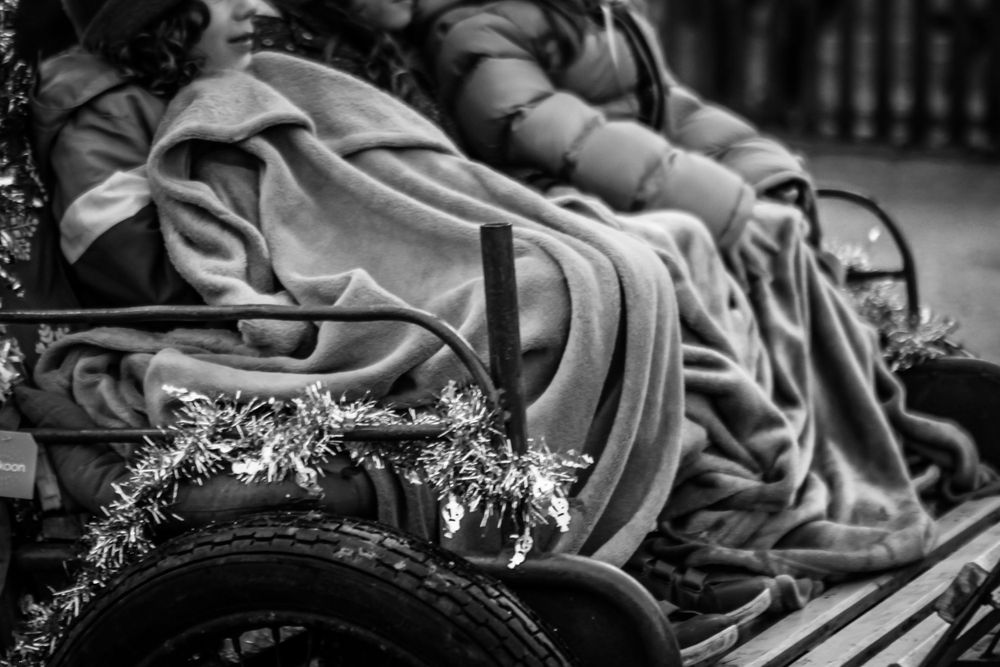 Black and white close-up of vintage motorcycle parts with delicate floral details.