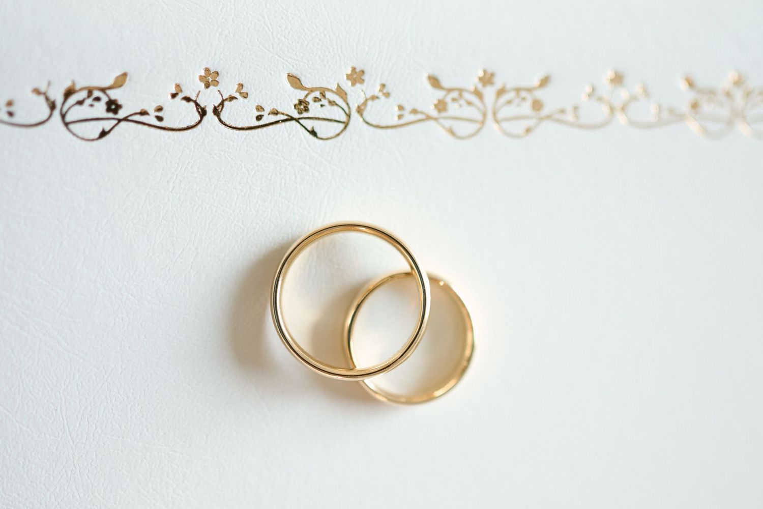 Gold rings on a white wedding certificate folder at Fairfield Inn & Suites Lodi, California.