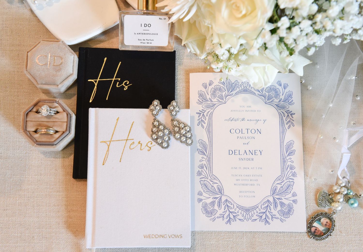 Elegant wedding stationery with gold His and Hers vow books and lilac invitation alongside sparkly bridal accessories.