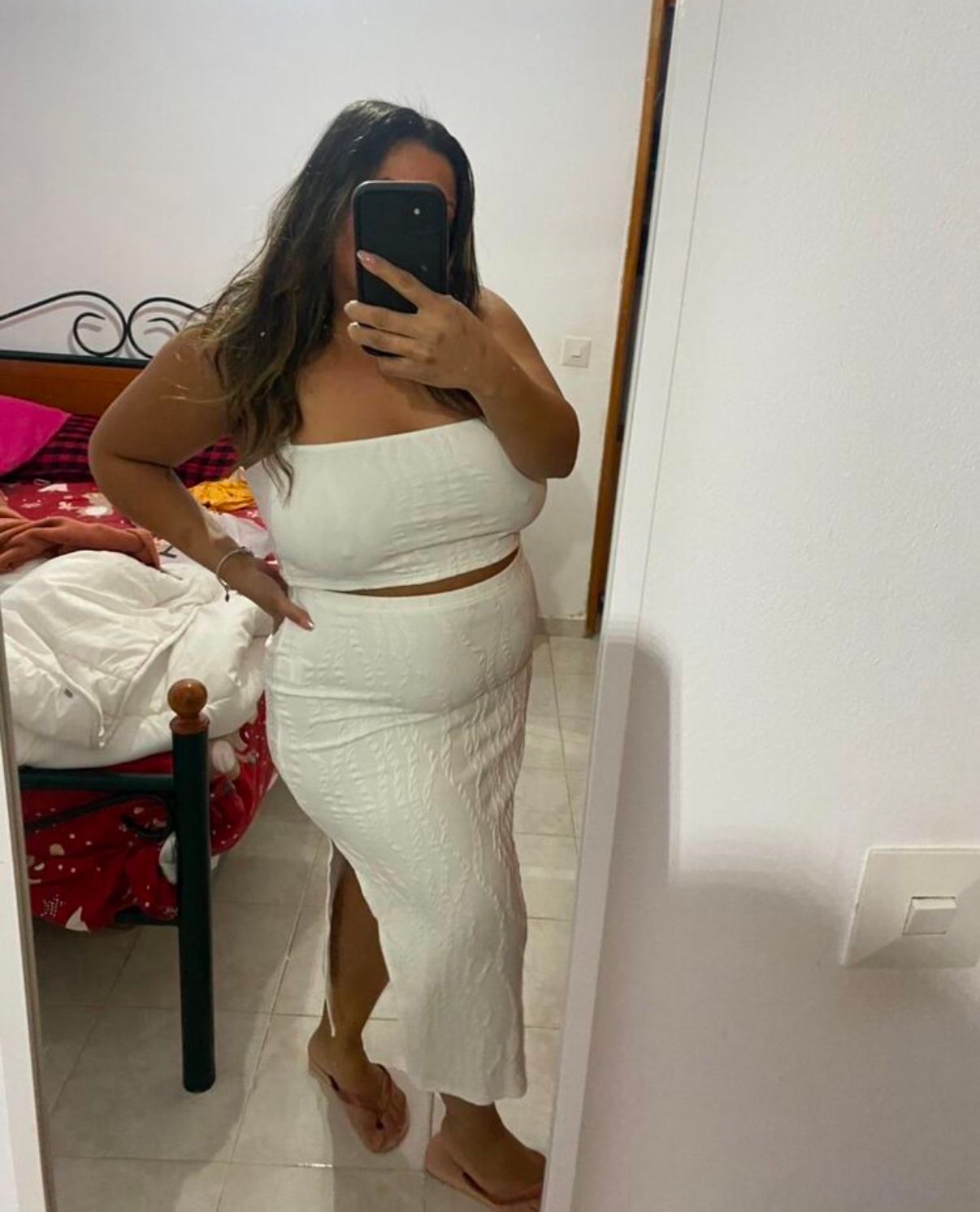 White two-piece outfit set photographed in mirror selfie style.