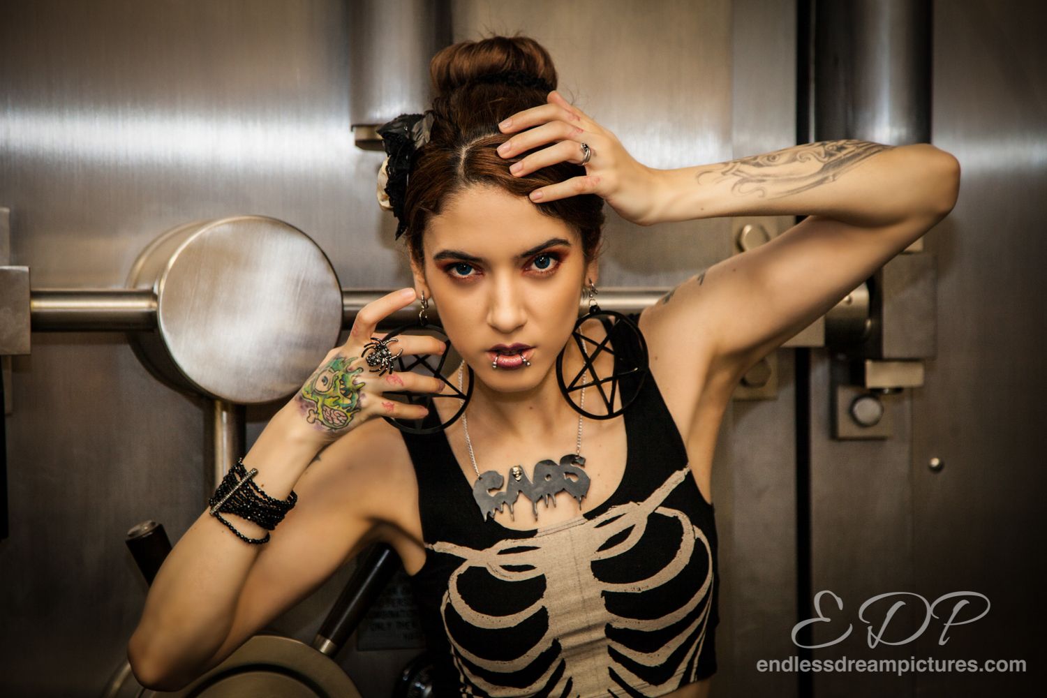Edgy skeleton costume with tattoos in industrial setting.