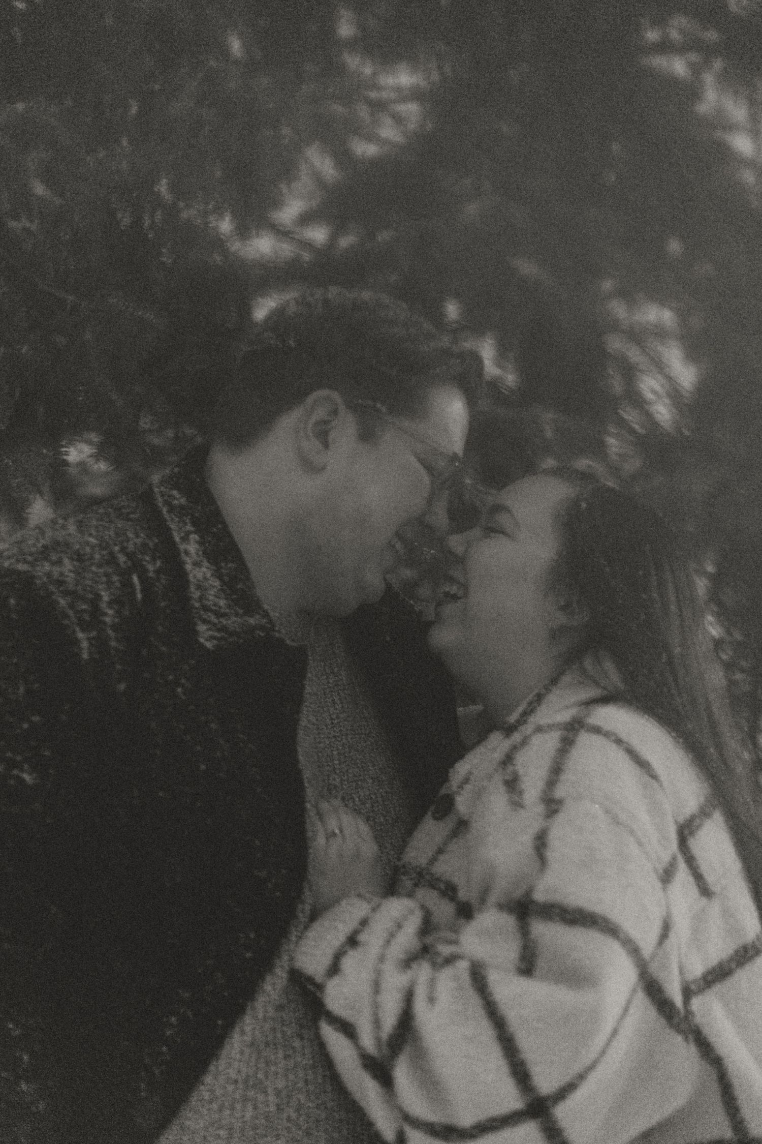 Man and Women kiss in the snow.