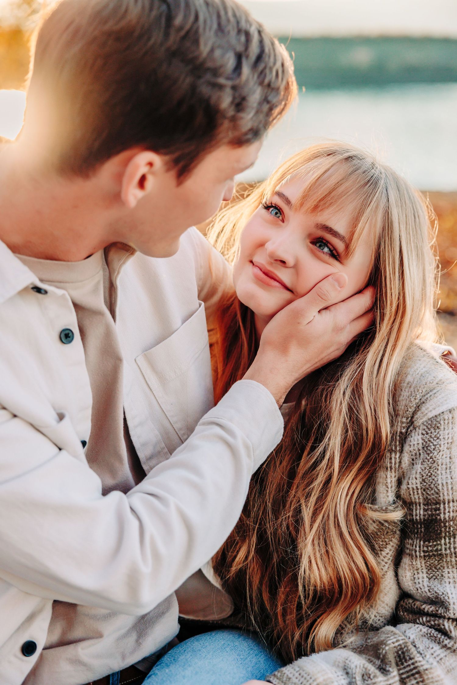 Intimate moment between couple with soft natural lighting.