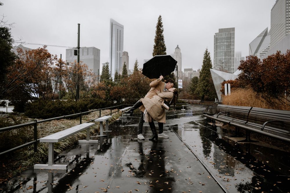 Rainy day walk with skyline backdrop, photographed by Albany Capture - proposal photography experts in Chicago.