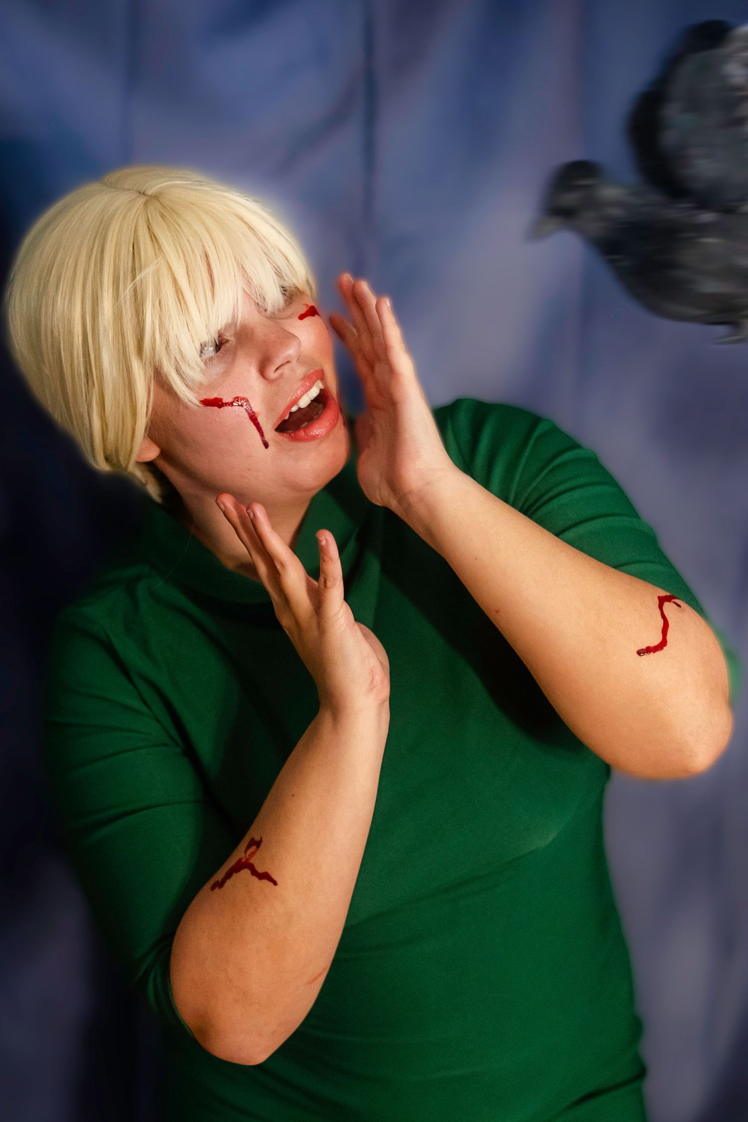 Person in emerald green pencil bodycon dress emotional distress the birds alfred hitchcock halloween costume