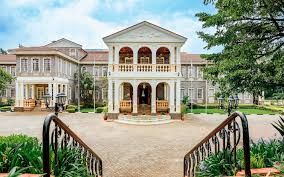luxury garden wedding venue in Nairobi, captured by Nairobi Wedding Photographer, Bonnie Gichuru, showcasing lush greenery and flower arches