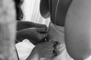 Black and white candid moments of wedding preparation.