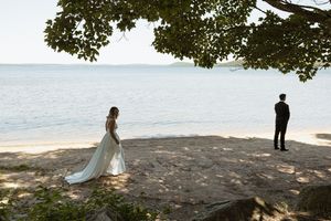 Scenic waterfront wedding photos with silhouettes against a tranquil lake backdrop.