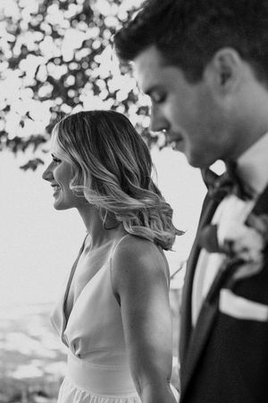 Artistic black and white wedding photos capturing tender moments between newlyweds.