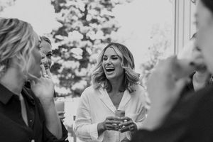 Joyful candid moments captured in black and white during a wedding celebration.