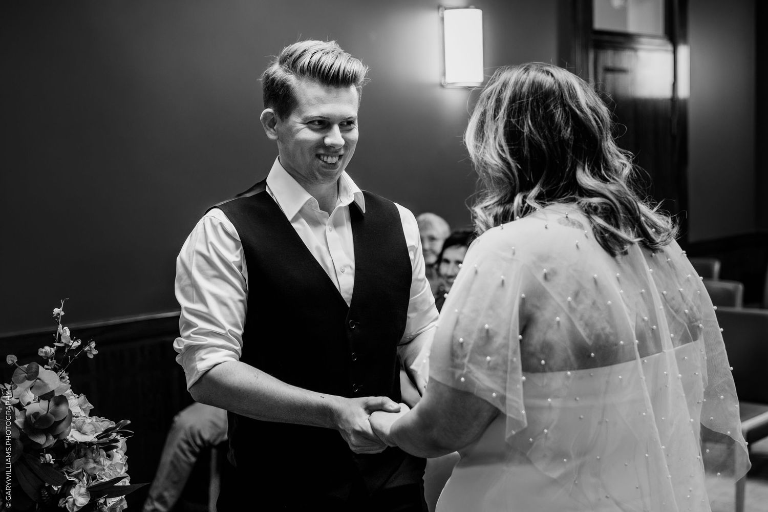 A romantic black and white wedding dance sequence showing multiple candid moments between the newlyweds.