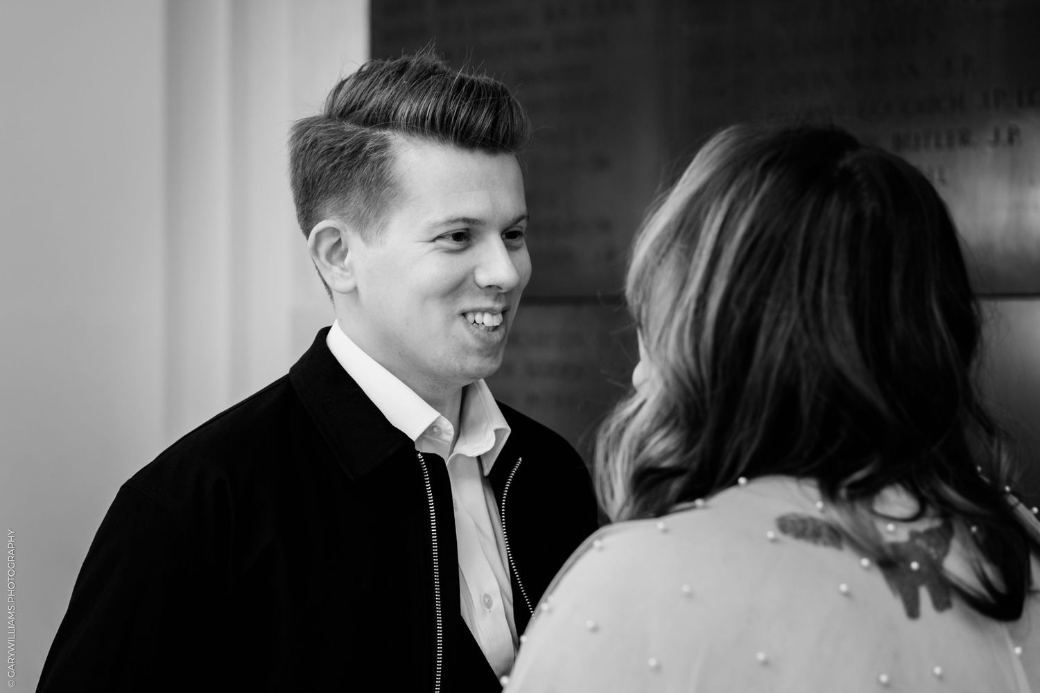 A black and white photo sequence showing a couple sharing romantic moments and laughter together.