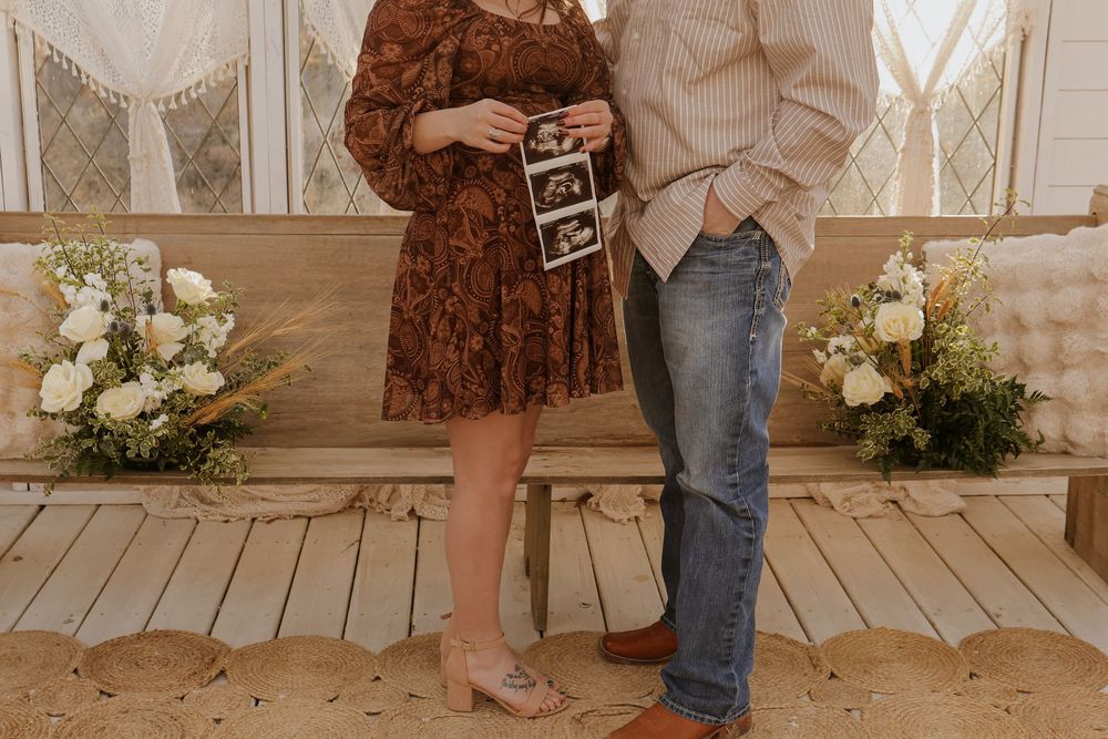 Candid moments captured during pregnancy announcement photoshoot.