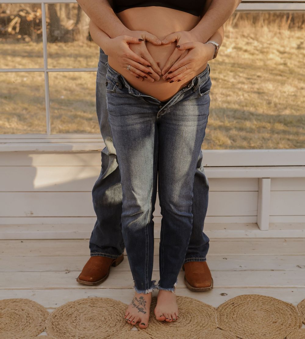 Close-up shots of bare feet and boots on a wooden floor with ultrasound photos.