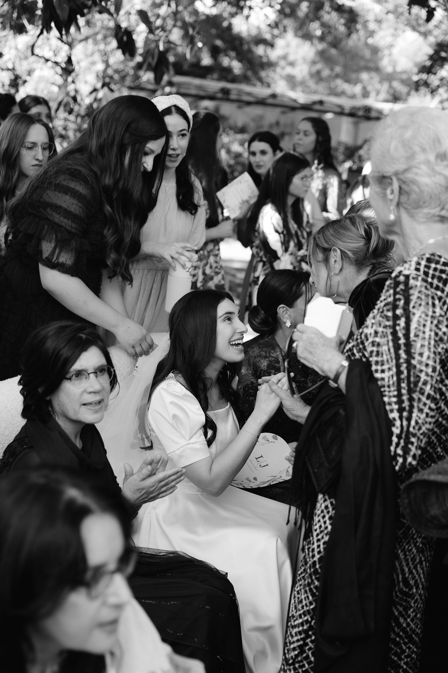 A series of black and white wedding photos showing intimate moments during a dance celebration.