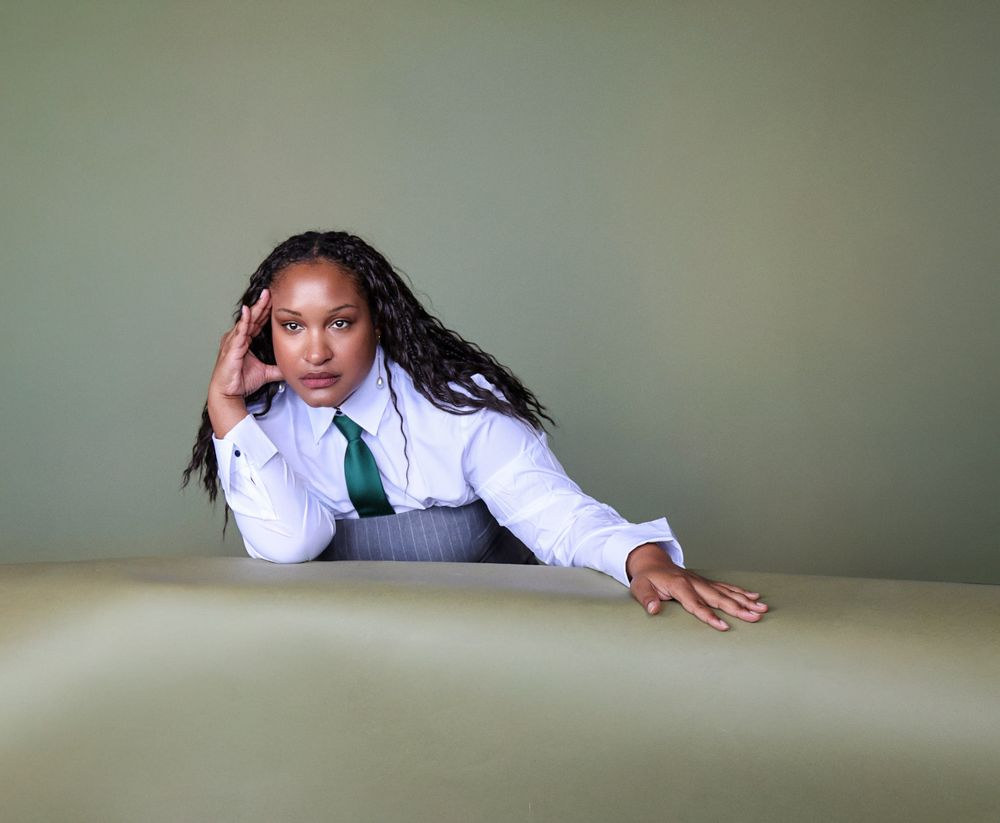 Person in white long sleeve shirt lying on floor in various relaxed poses against neutral background.