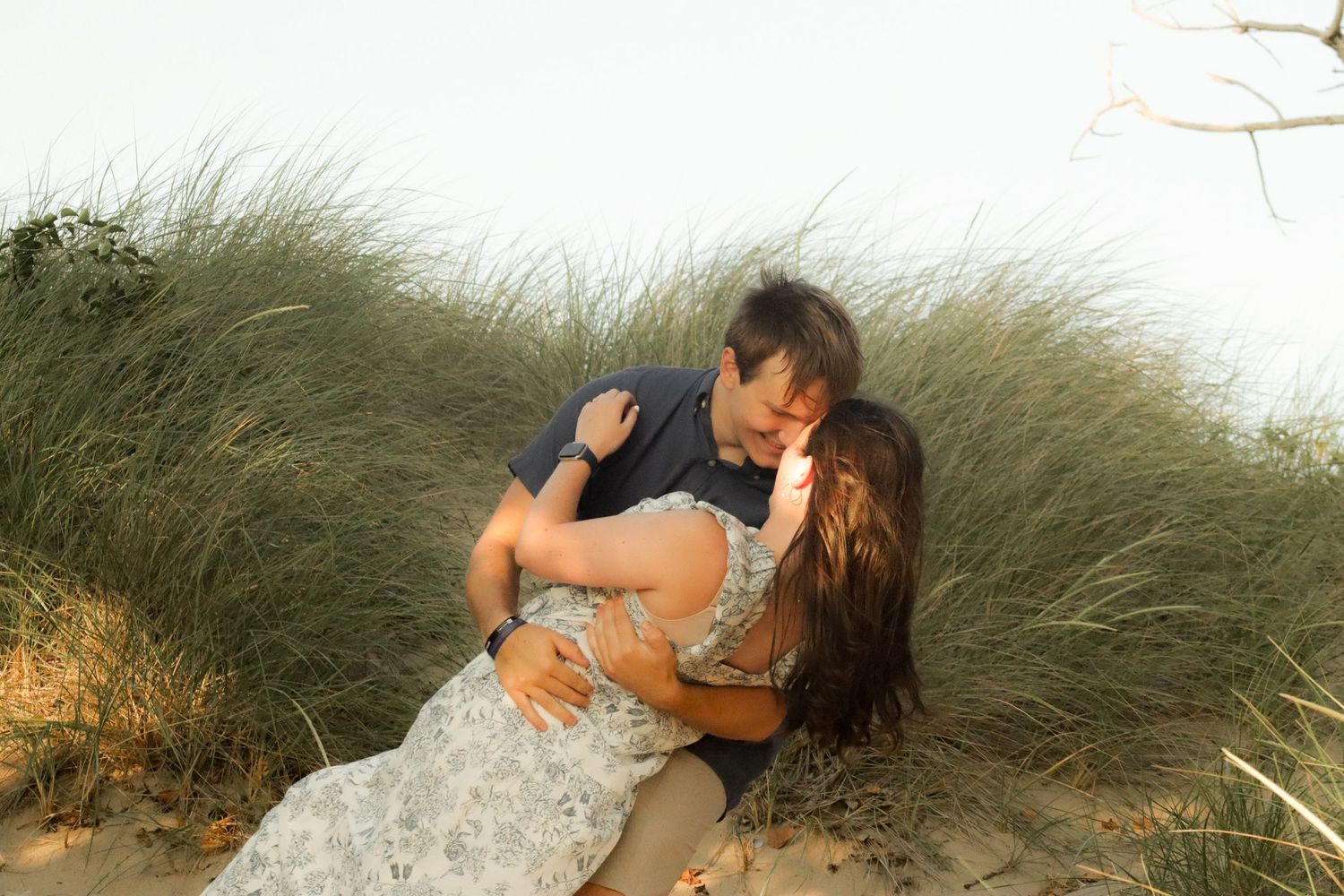 West Michigan Photographer: photo of a couple admiring one another on the beach