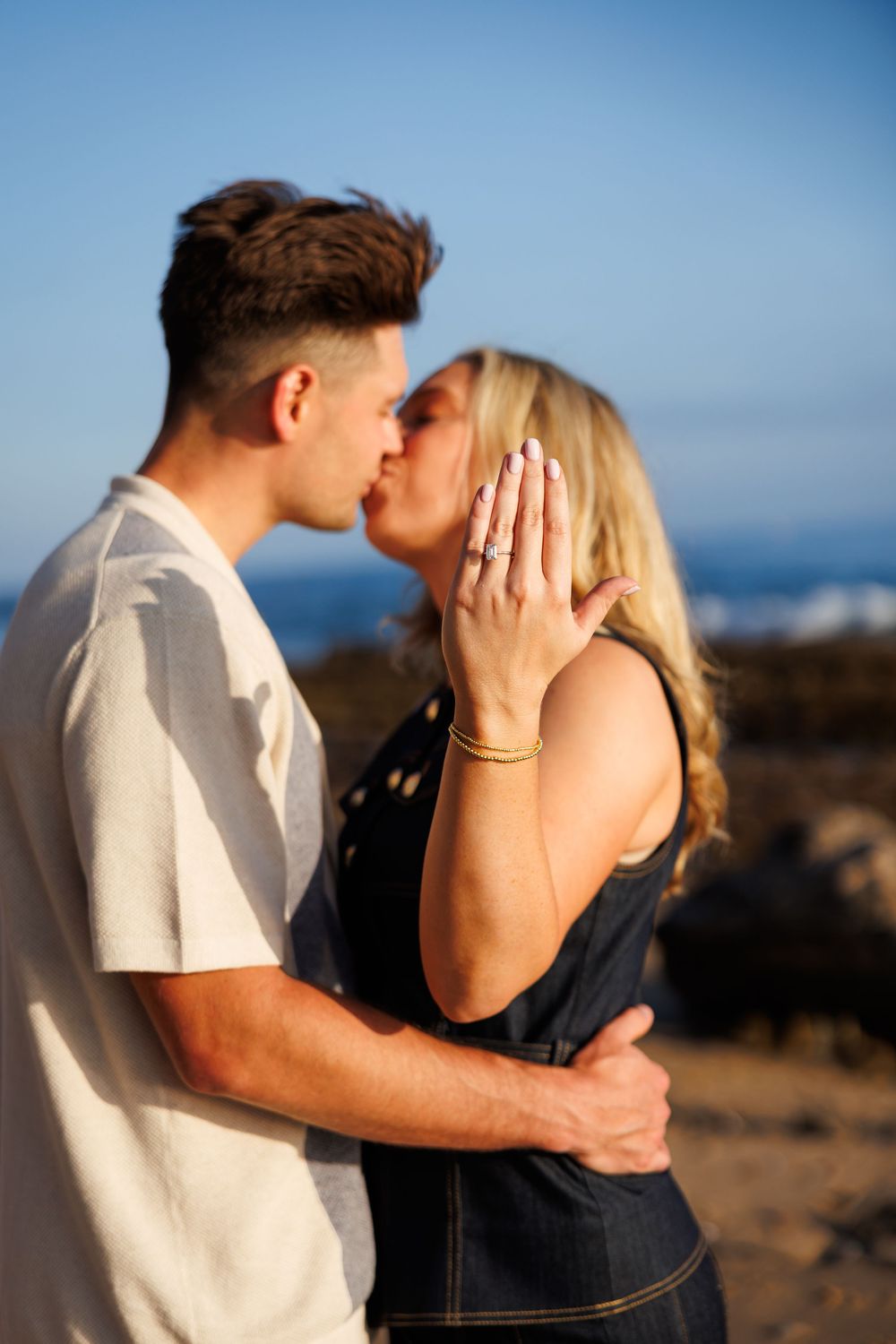 A romantic proposal photo on a beach at sunset in Newport Beach at Crystal Cove.