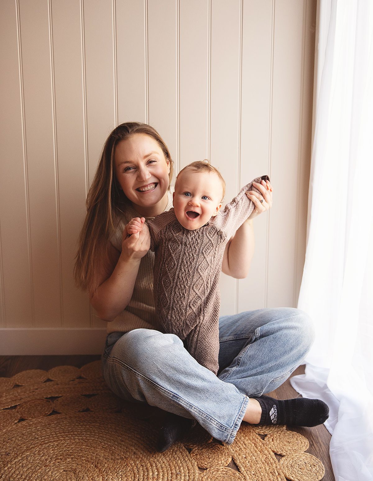 A joyful moment shared between mum and baby during a baby photoshoot in Bexley