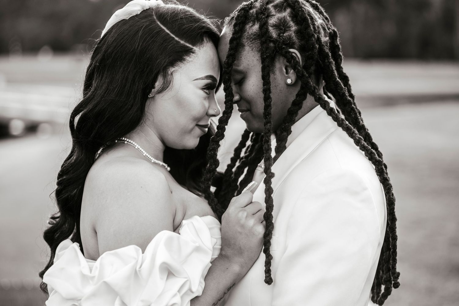 A romantic series of black and white photos showing intimate moments between a loving couple in wedding attire.