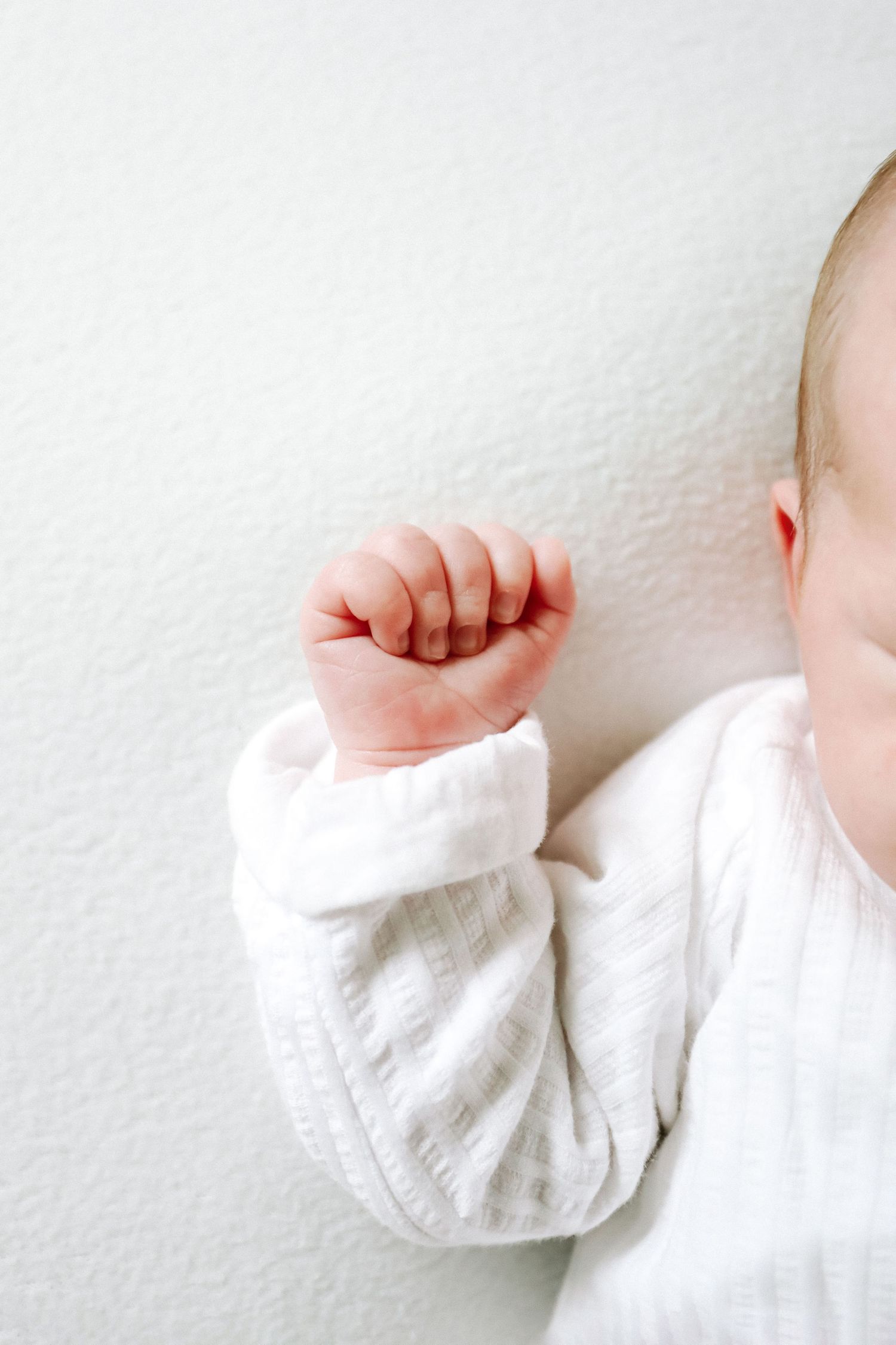 Natural baby photography Nottingham sleepy newborn close up tiny hands detail shot