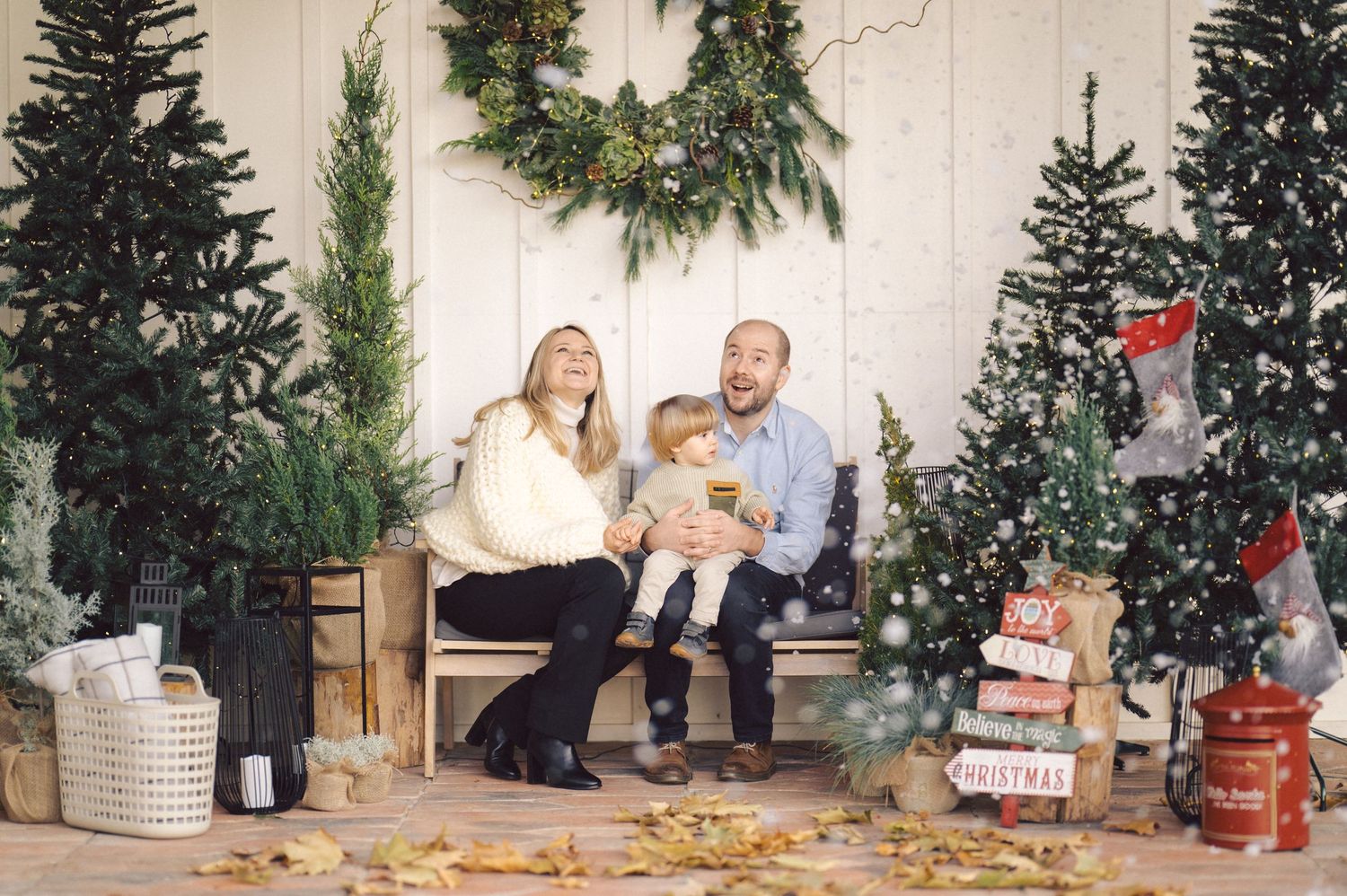 Small sequence of vintage photographs showing holiday celebrations and gatherings around decorated Christmas trees.