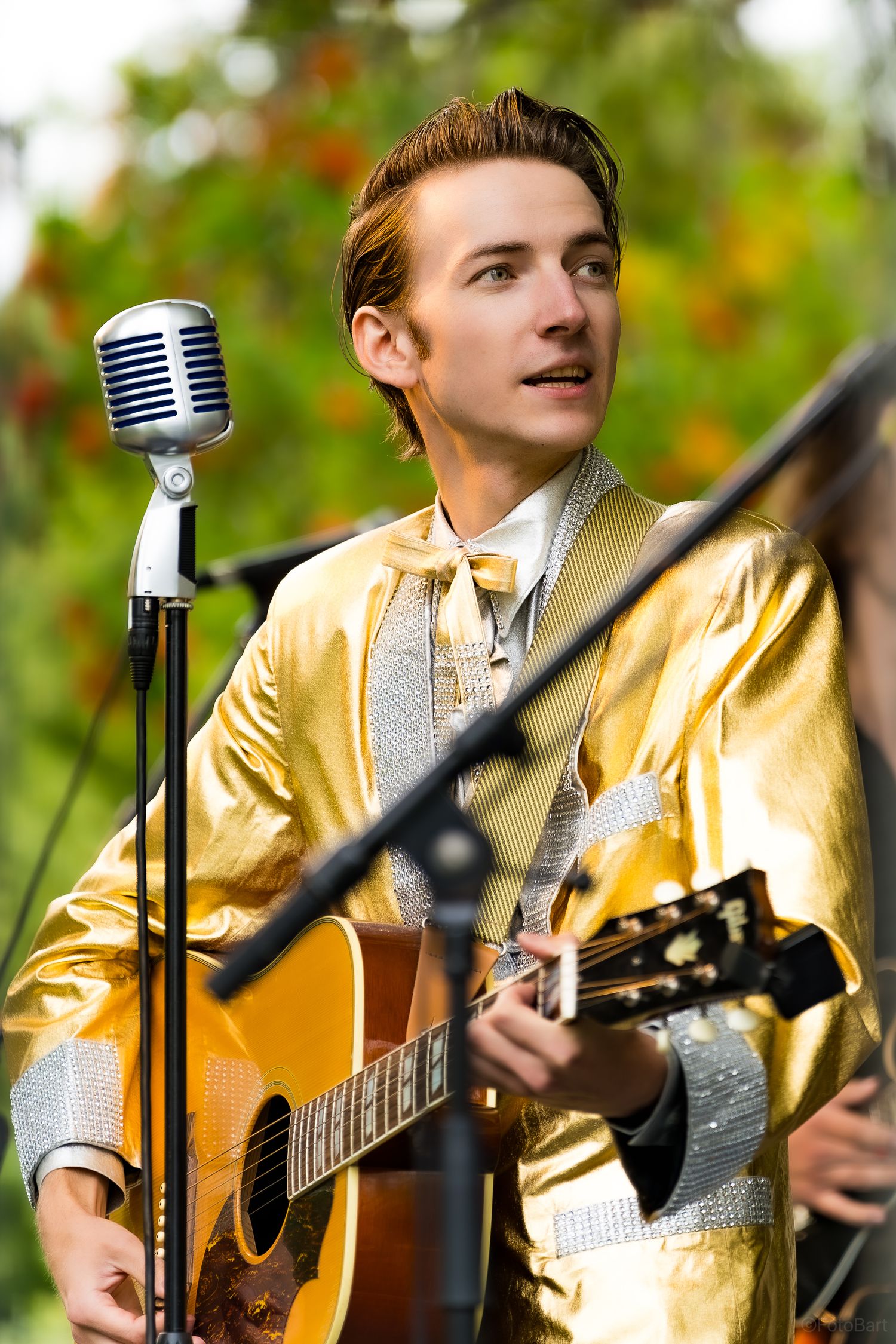 Outdoor portrait of a musician with a guitar. Perfect for artist branding, concert promotions, and editorial photography.