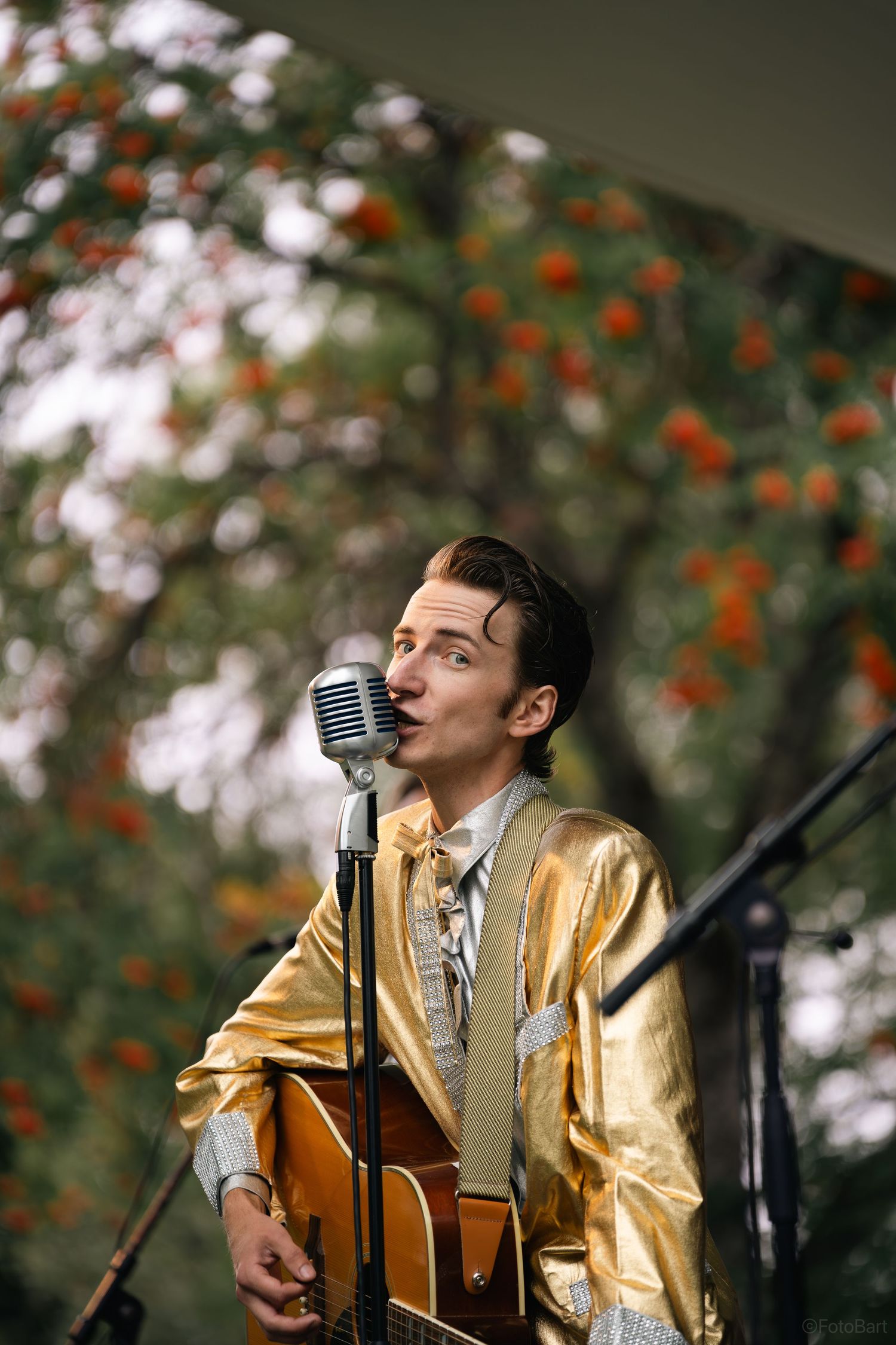 Outdoor portrait of a musician with a guitar. Perfect for artist branding, concert promotions, and editorial photography.