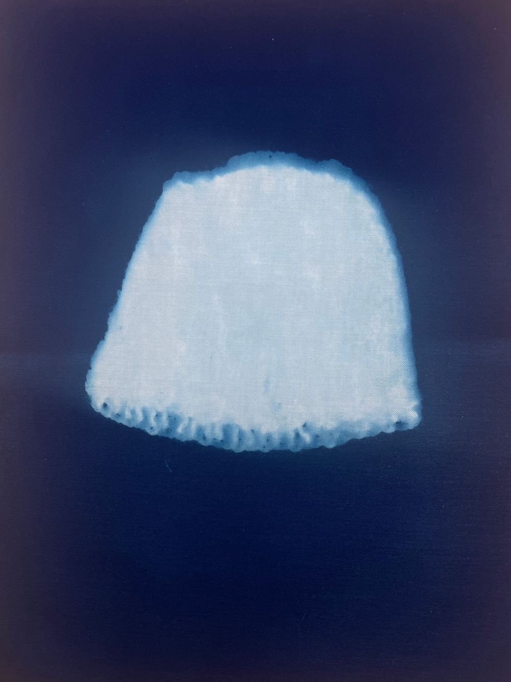 A series of white curved shapes against a dark background showing a progressive sequence.