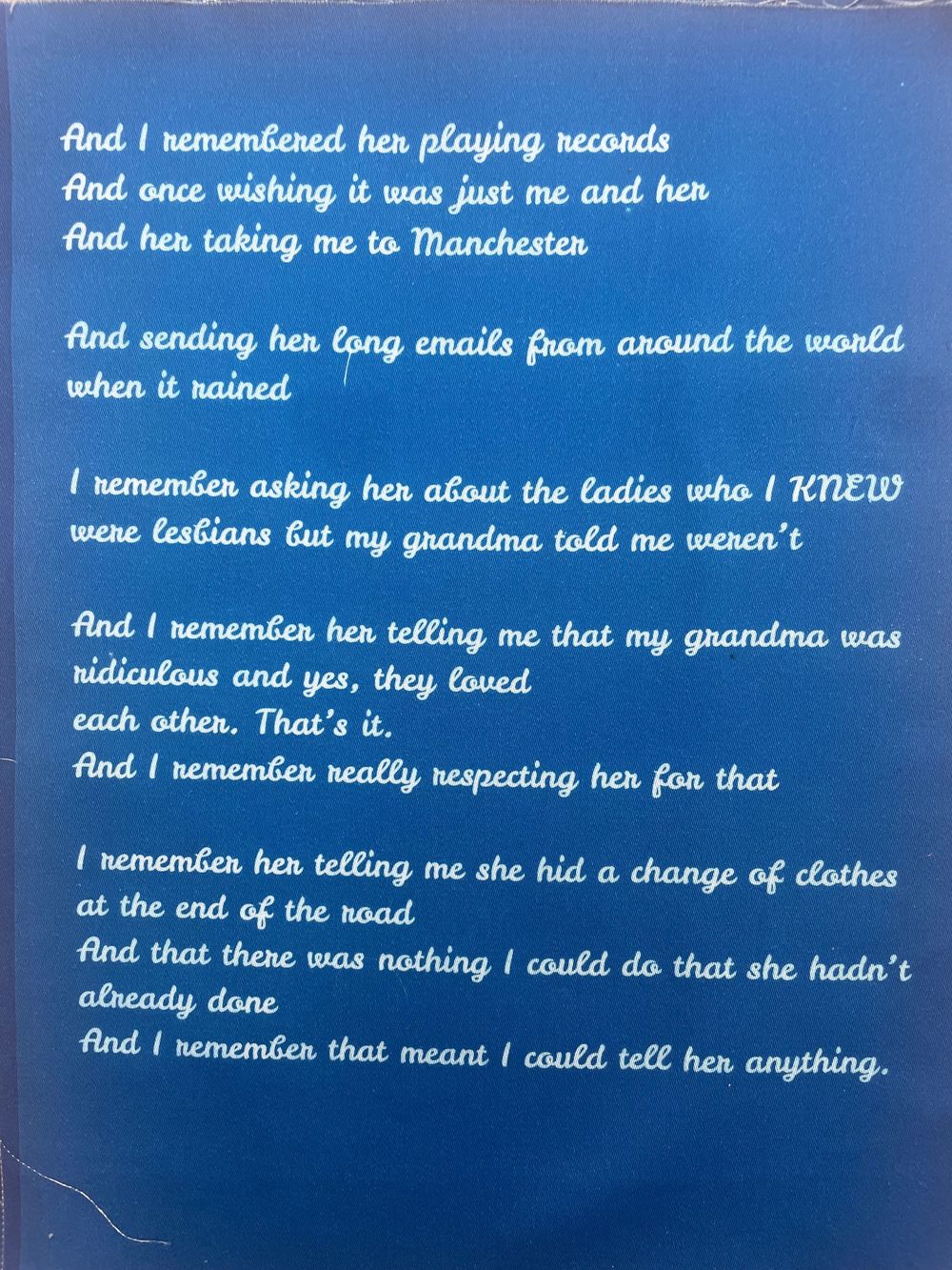 Blue paper with handwritten text fragments about memories and relationships arranged in a collage-like format.