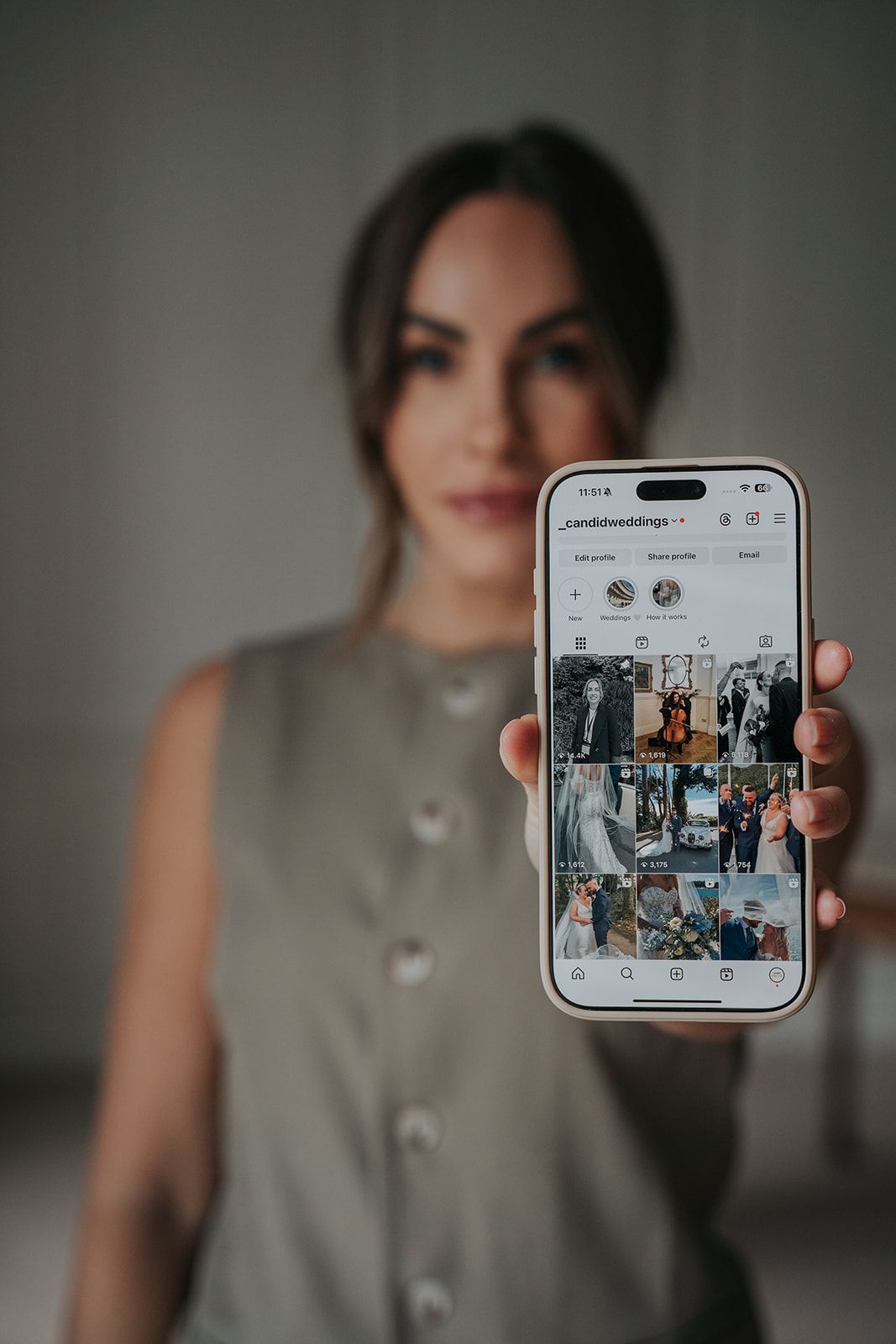 Girl holding her phone showing her instagram page for devon branding shoot