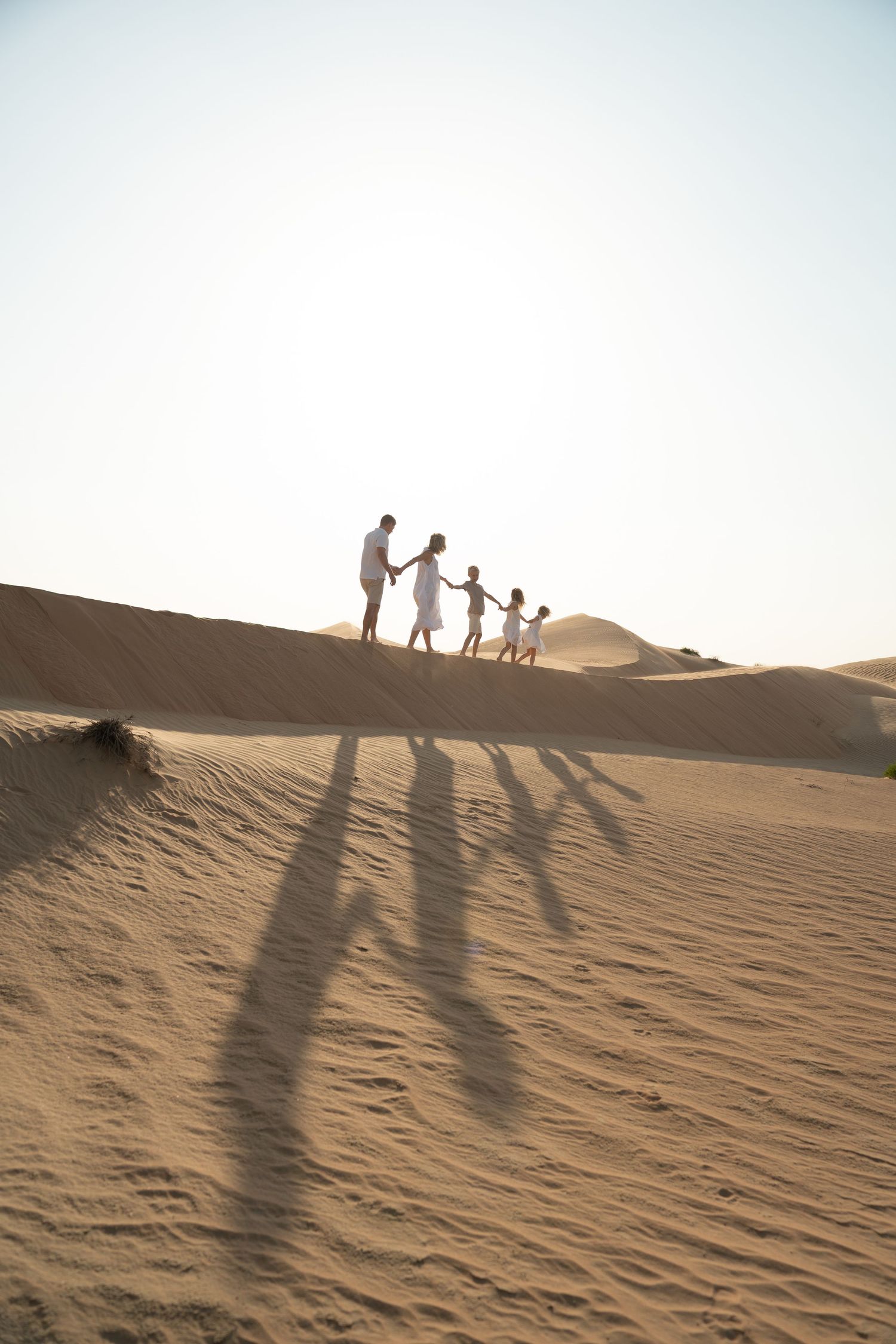 desert family photoshoot in abu dhabi relaxed golden hour sunset