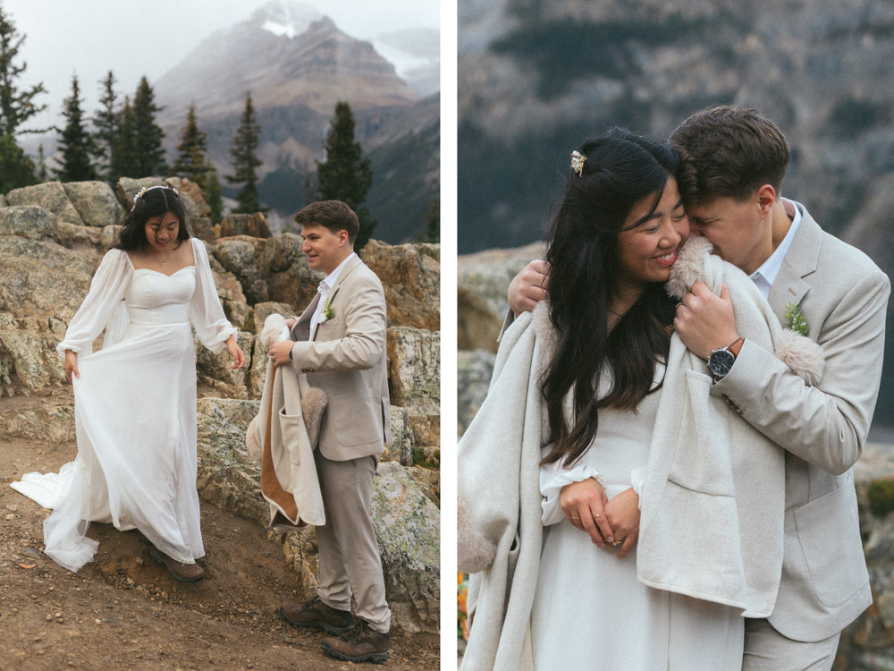 Groom nuzzles bride as he helps her into her fur coat surrounded by mountains
