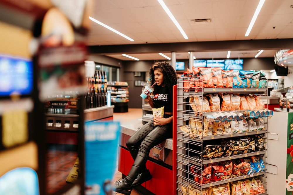 Interior view of a convenience store with fluorescent lighting and refrigerated display cases. Creative photography