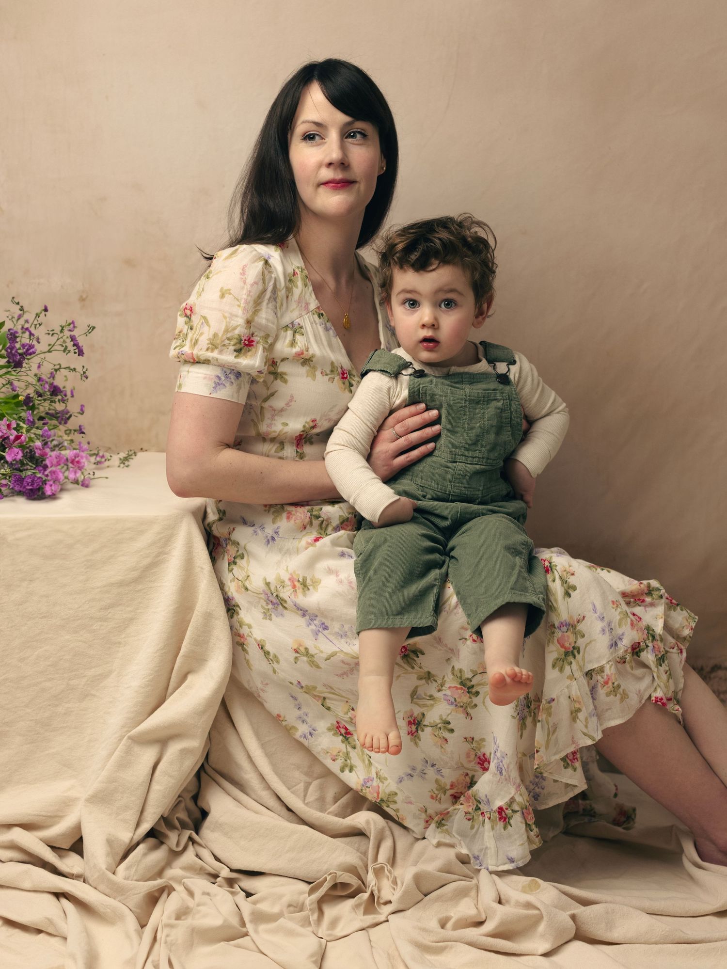 A series of vintage-style portraits showing tender moments between a parent and child against a neutral backdrop.