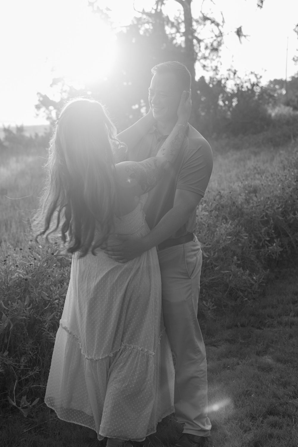Black and white cinematic image of couple embracing during their engagement session with Photographer, serves St Simons Island, Sea Island