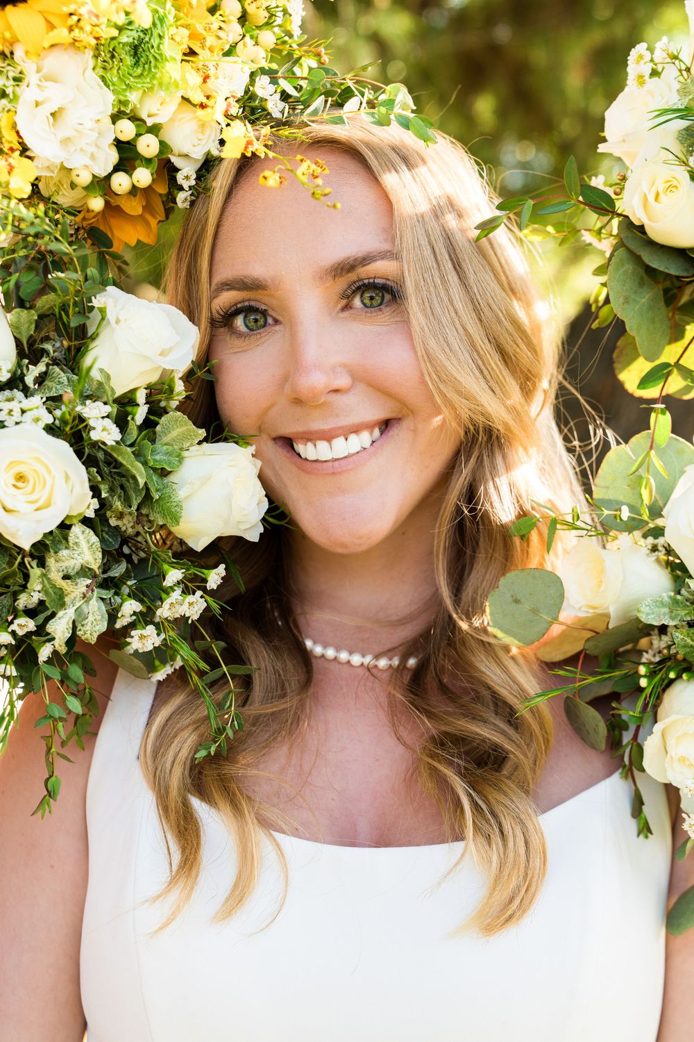 Three similar photos showing a bridal portrait with white flowers and greenery in an outdoor garden setting.