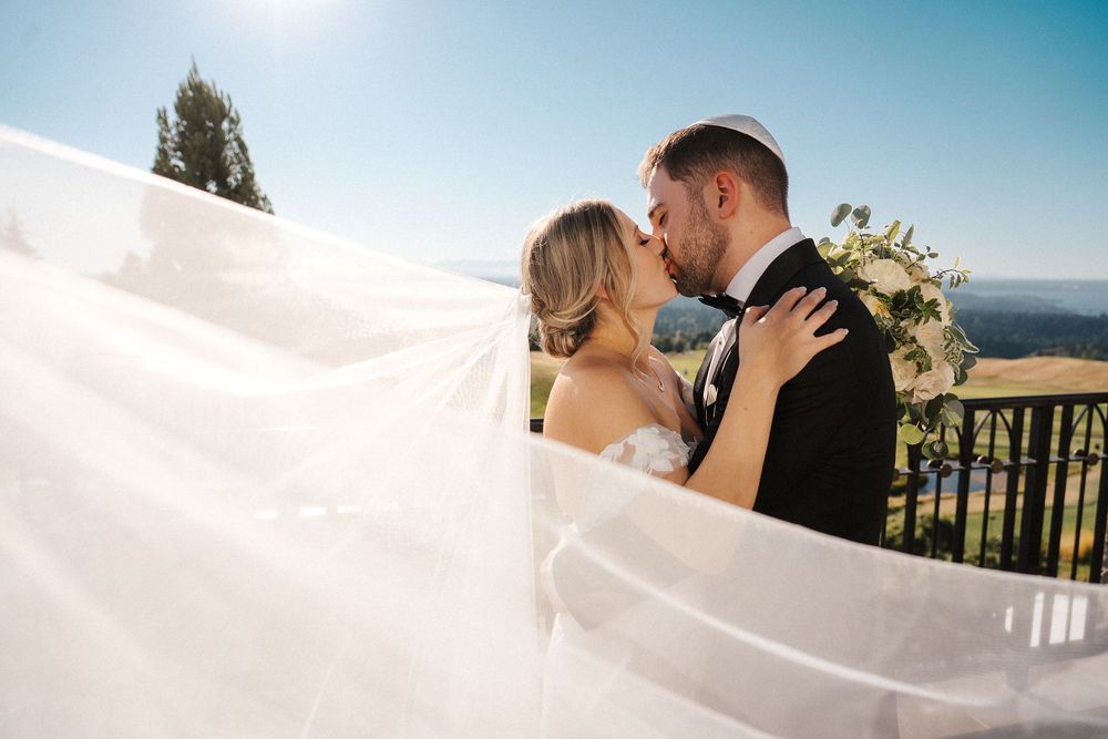 A romantic wedding photo collage showing intimate moments between newlyweds against a scenic coastal backdrop.