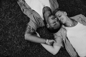 Joe and Trevor lay in the grass at volunteer park after their proposal