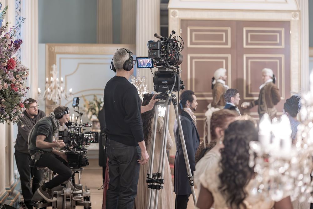 Behind the scenes of a Bridgerton Netflix filming setup at Newark Town Hall, showing the media crew capturing the event.