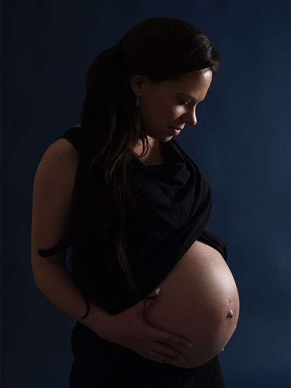 Maternity photo on navy blue studio backdrop, High Wycombe, Photograph by Abigail's Studio